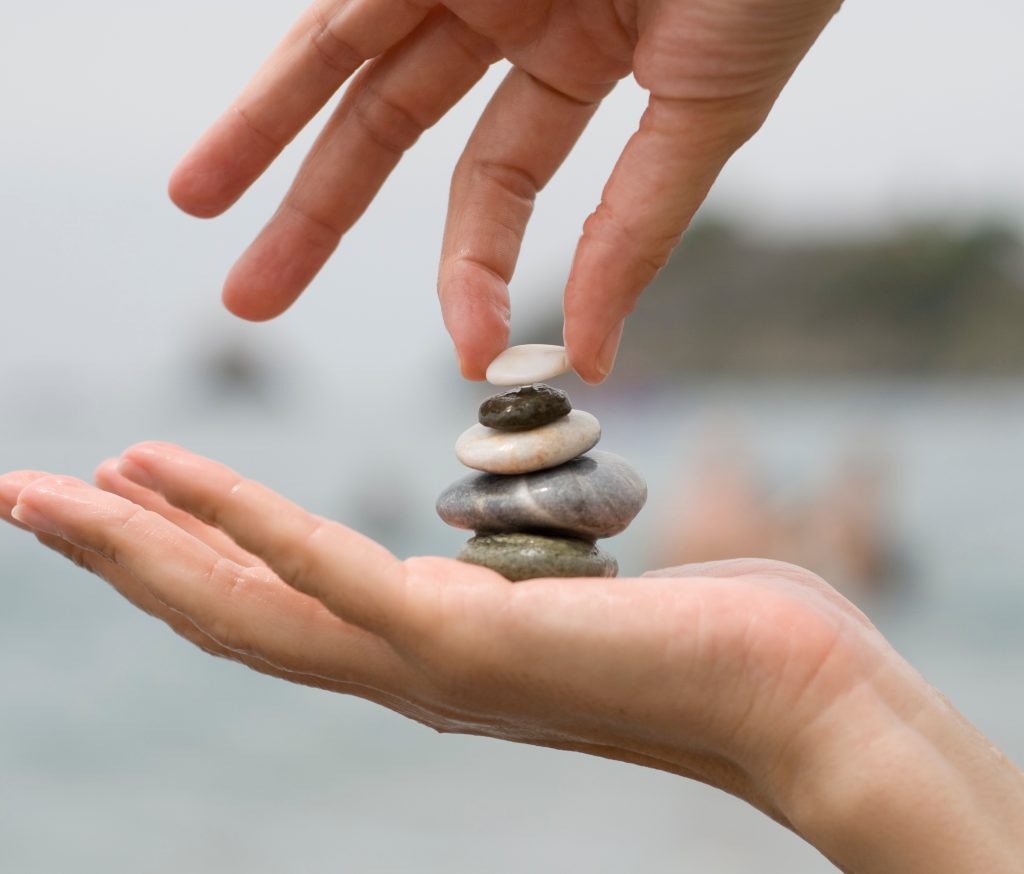 putting-last-pebble-pile-stones